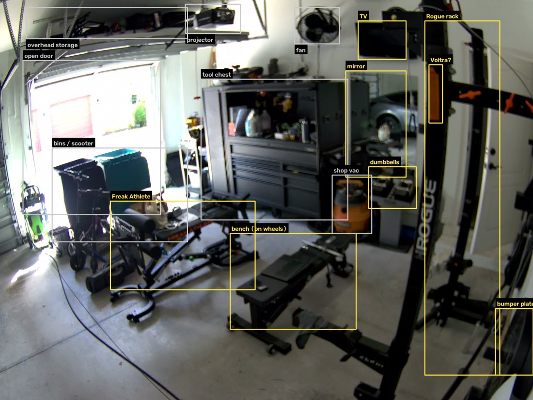 The PTZ view with boxes drawn around identified objects: rack, bench, Freak Athlete machine, mirror, dumbbells, TV, tool chest, shop vac, fan, projector